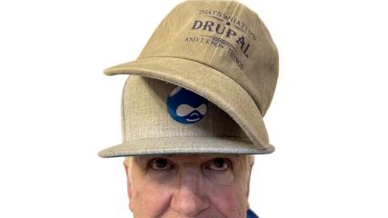 Me wearing a couple Drupal hats